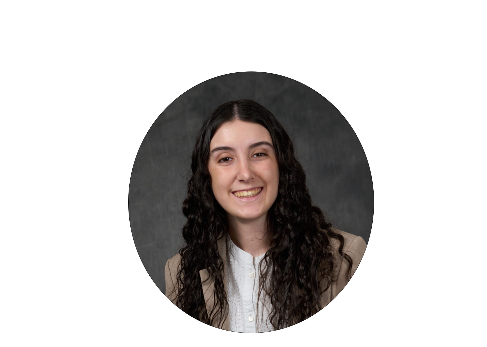 Helenna, in a professional picture setting, she's wearing a white button up and beige blazer.