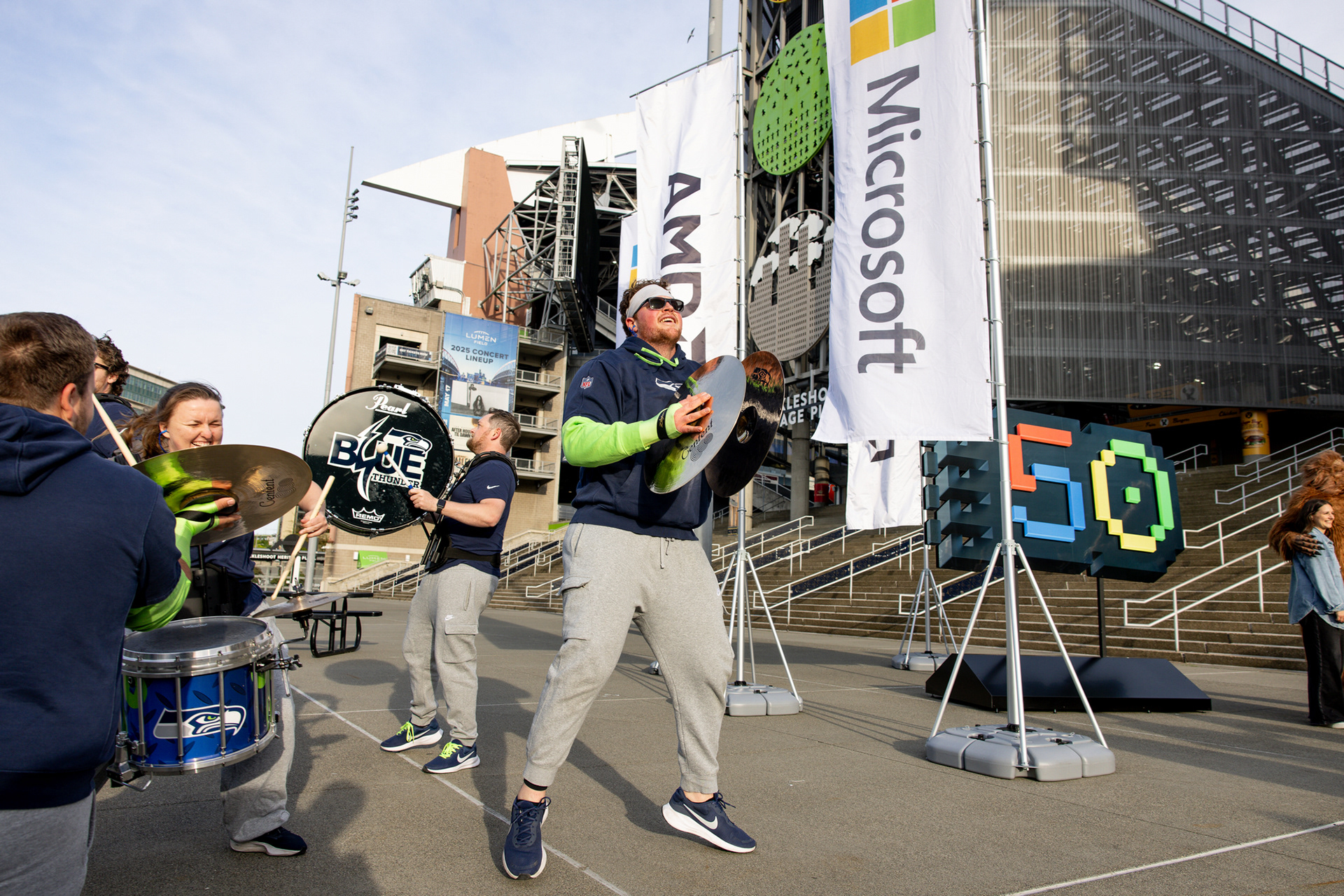 Kickoff energy moment featuring Blue Thunder, Sasquatch mascot, and Microsoft's 50th Anniversary