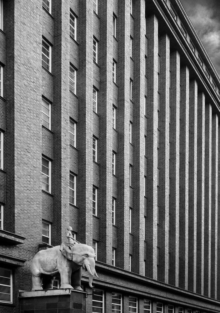 Black and white photograph by Mark Robert Davey of an elephant sculpture on a building in Hamburg.