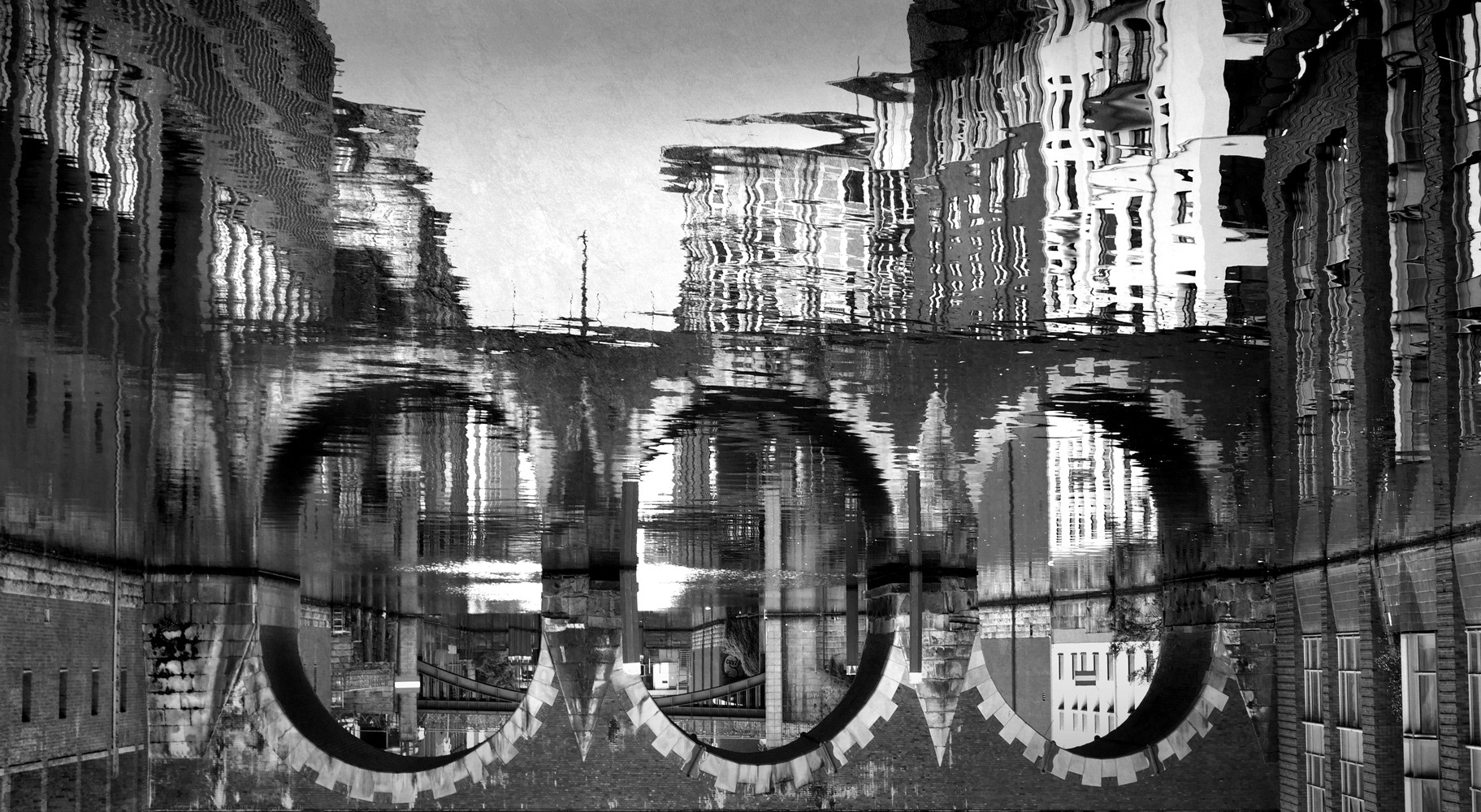 Black and white photograph by Mark Robert Davey showing the Ellerntorsbrücke in Hamburg.