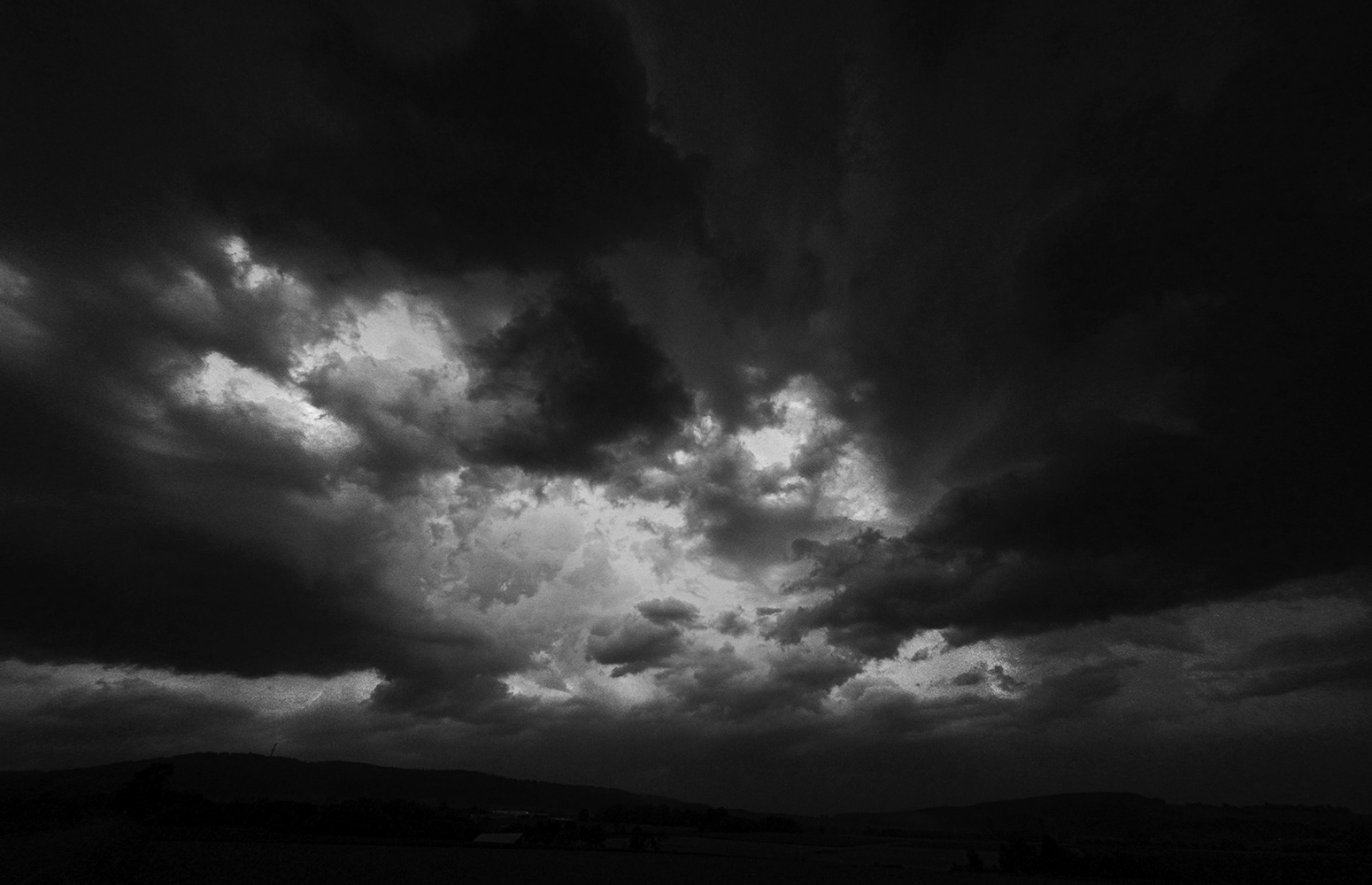 Black and white photograph of dark storm clouds