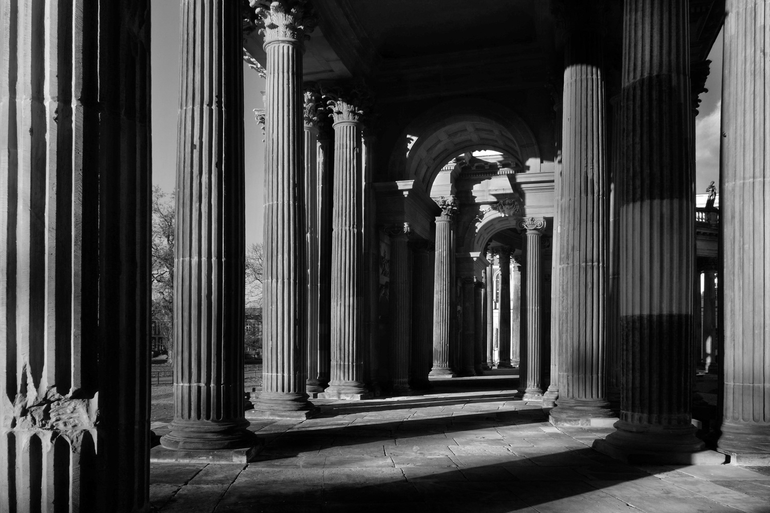 Black and white photograph of alcoves and shadows in Potsdam, Germany.