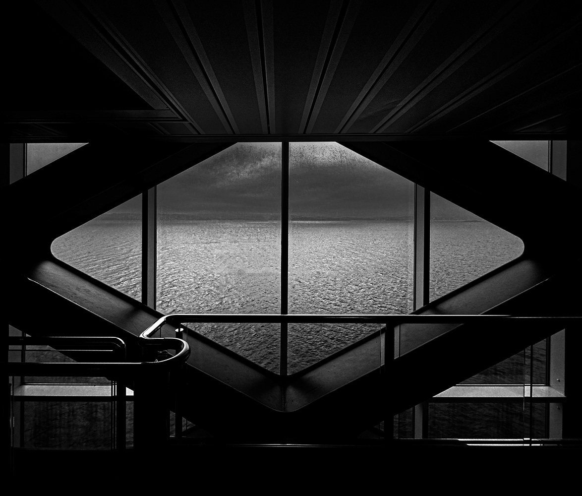 Black and white photograph of a storm out at sea from a ships window in Norway