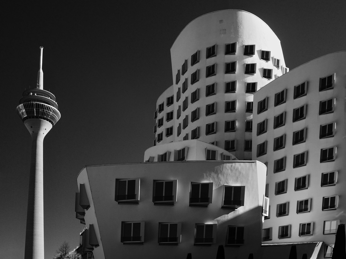 Black and white infrared photograph of the Gehry building and Rheineturm, Dusseldorf