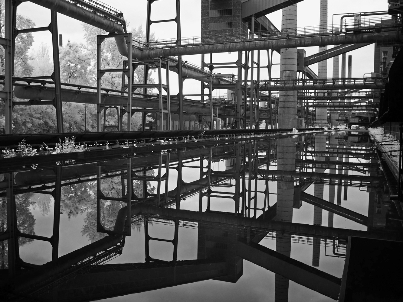 Infrared black and white photograph of the water basin in Zeche Zollverein Essen Germany