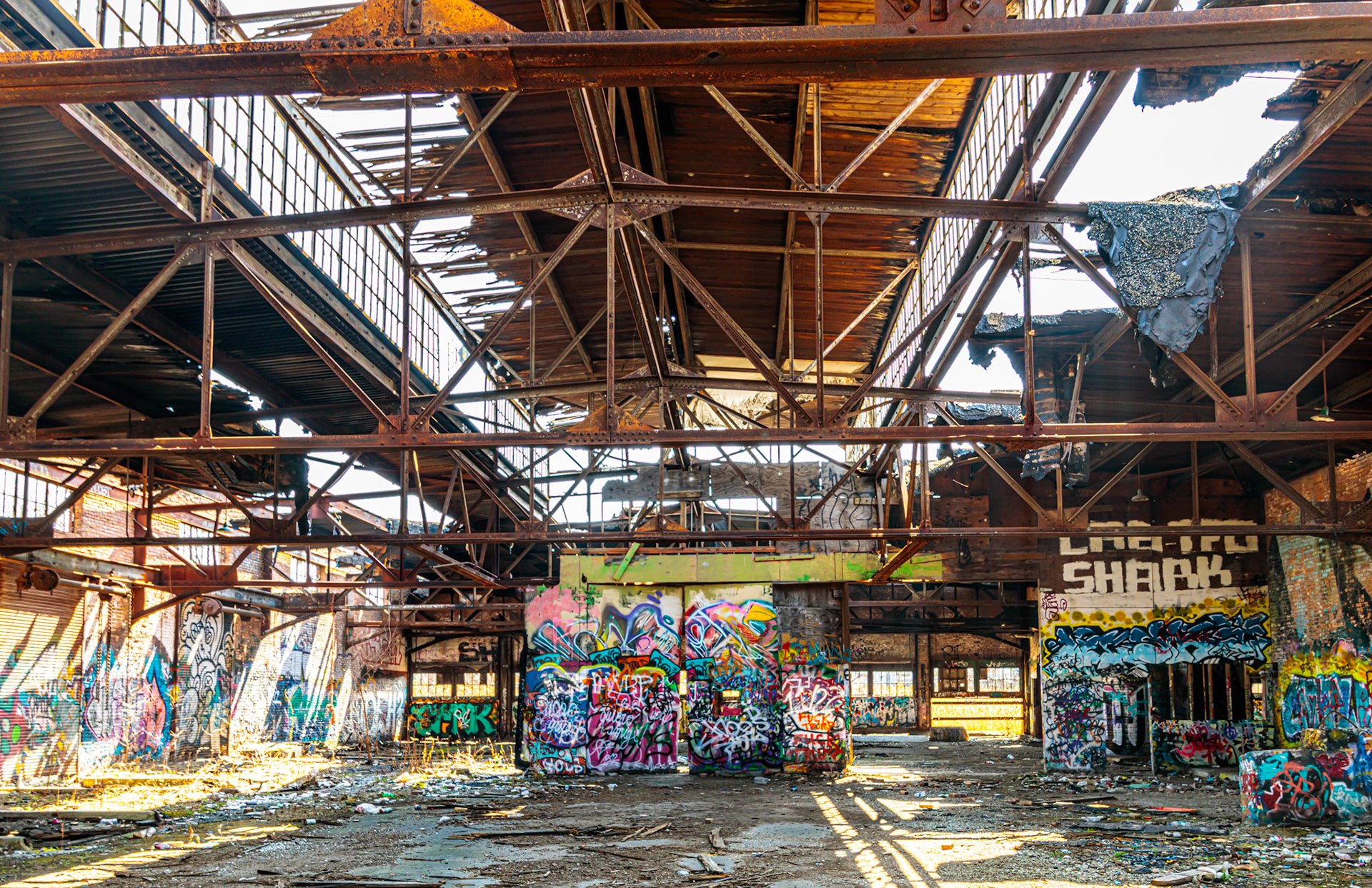 An abandoned grain mill missing its roof
