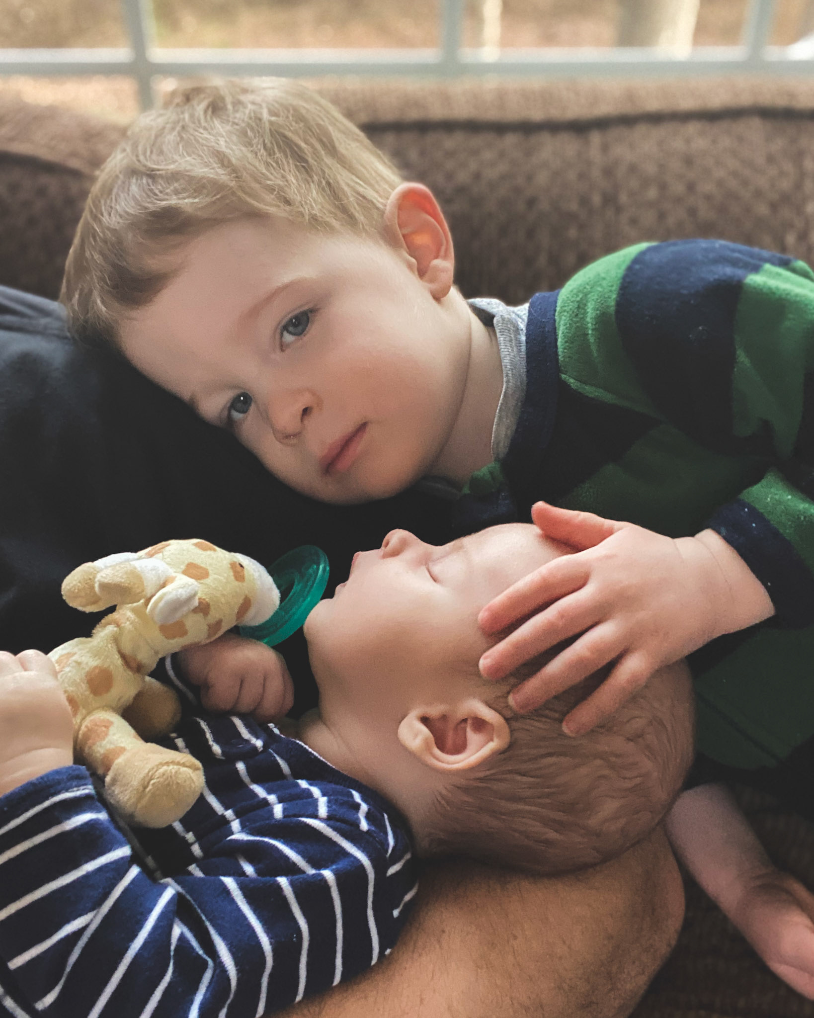 2020 was a long year with a pandemic and a poorly sleeping baby. My two year old snuggled up to one month old brother who was (finally!) sleeping in my arms, and I captured this using the selfie camera on my iPhone. 