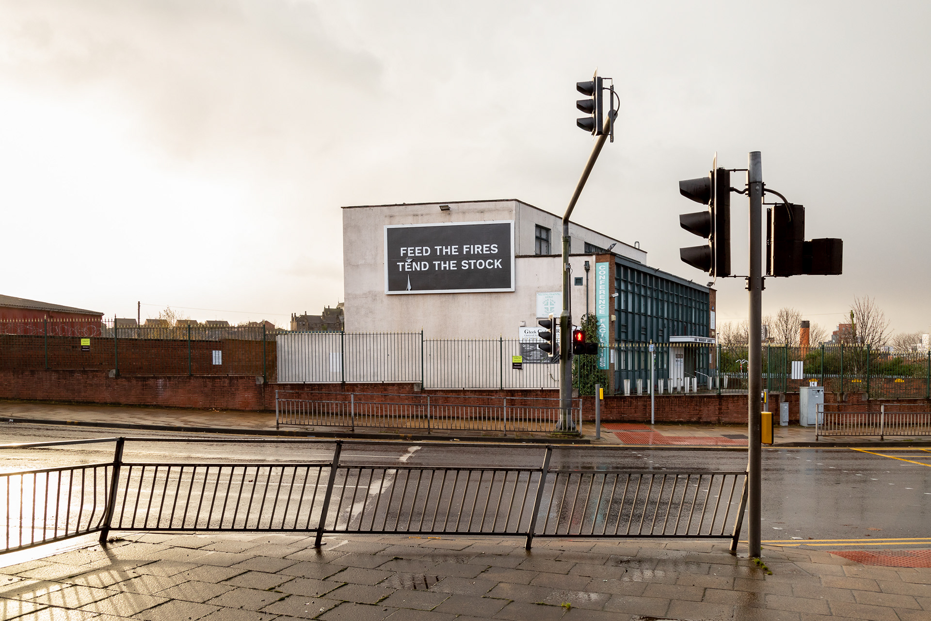 A billboard in Leeds, the billboard says 'Feed the fires, tend the stock'
