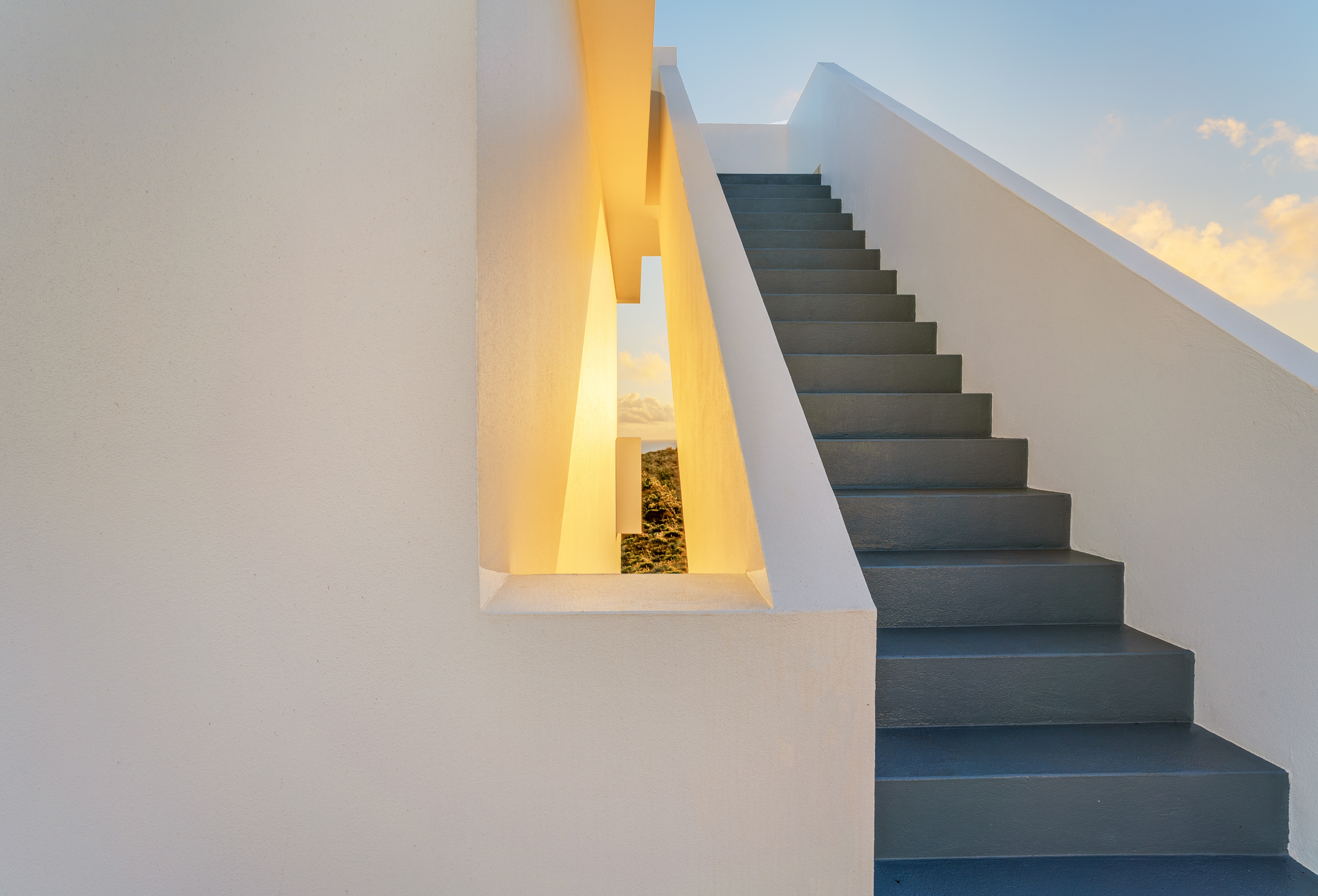 Modern Algarve villa photographed at golden hour – strong lines and coastal light.