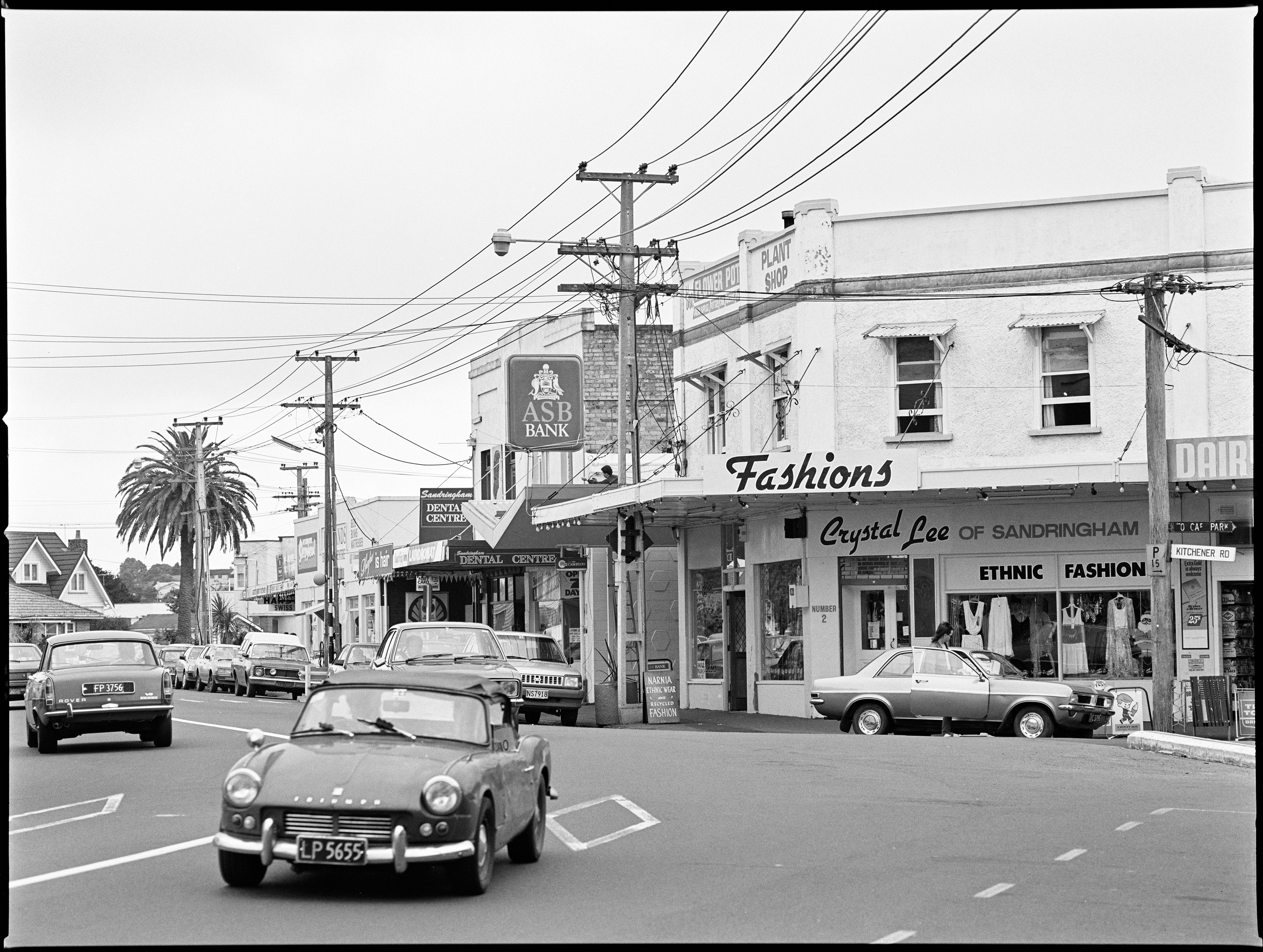 Photograph taken by Miles Hargest in 1989, facing south along Sandringham Road. The intersection of Sandringham and Kitchener Roads can be seen on the far right. Auckland Libraries Heritage Collections 273-HAR057-10.