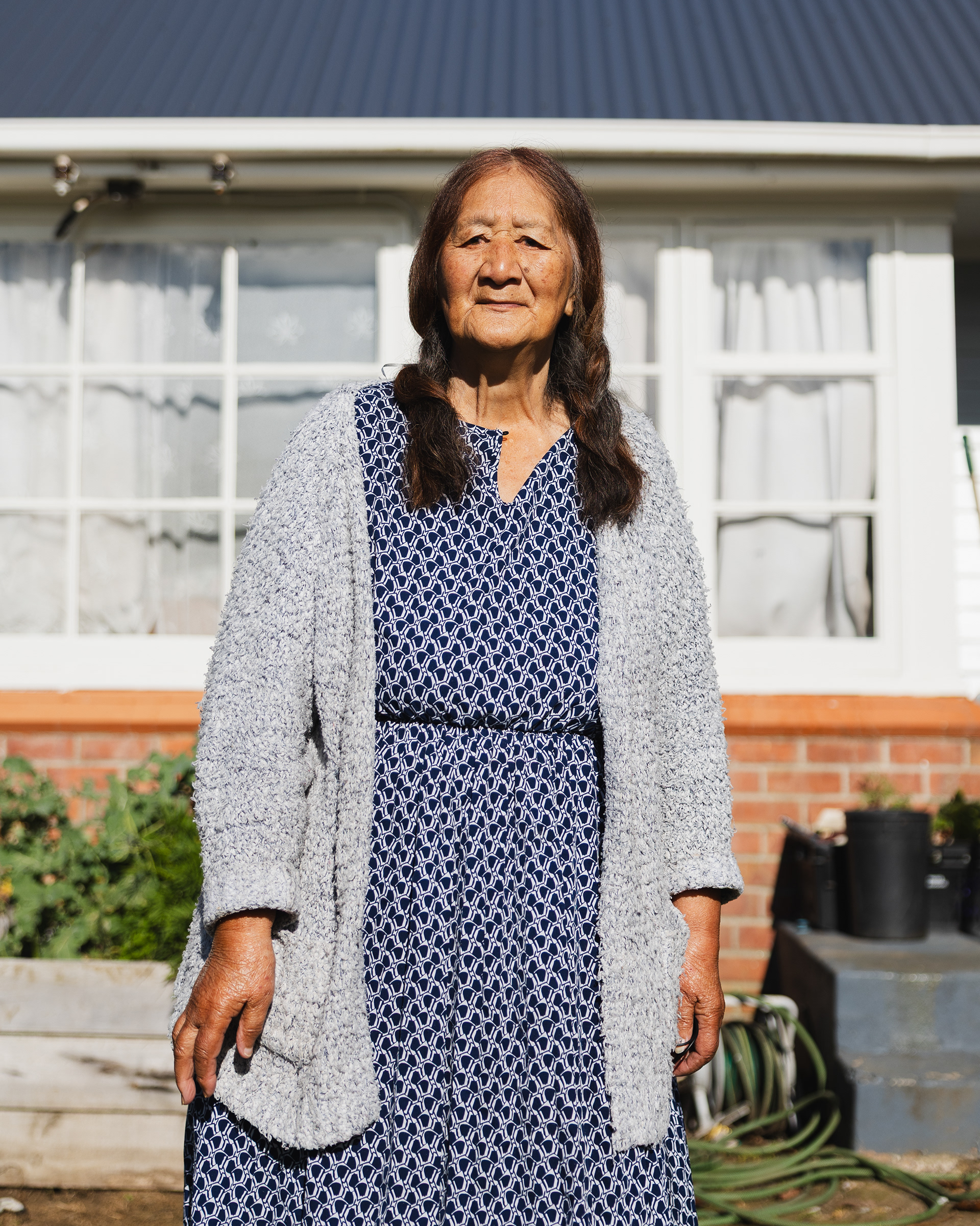  Rānana Taituha-Paul photographed outside her home in July 2026. She has lived in Sandringham for more than thirty years and was previously the co-coordinator for the Sandringham Community Market. Photograph by the author.