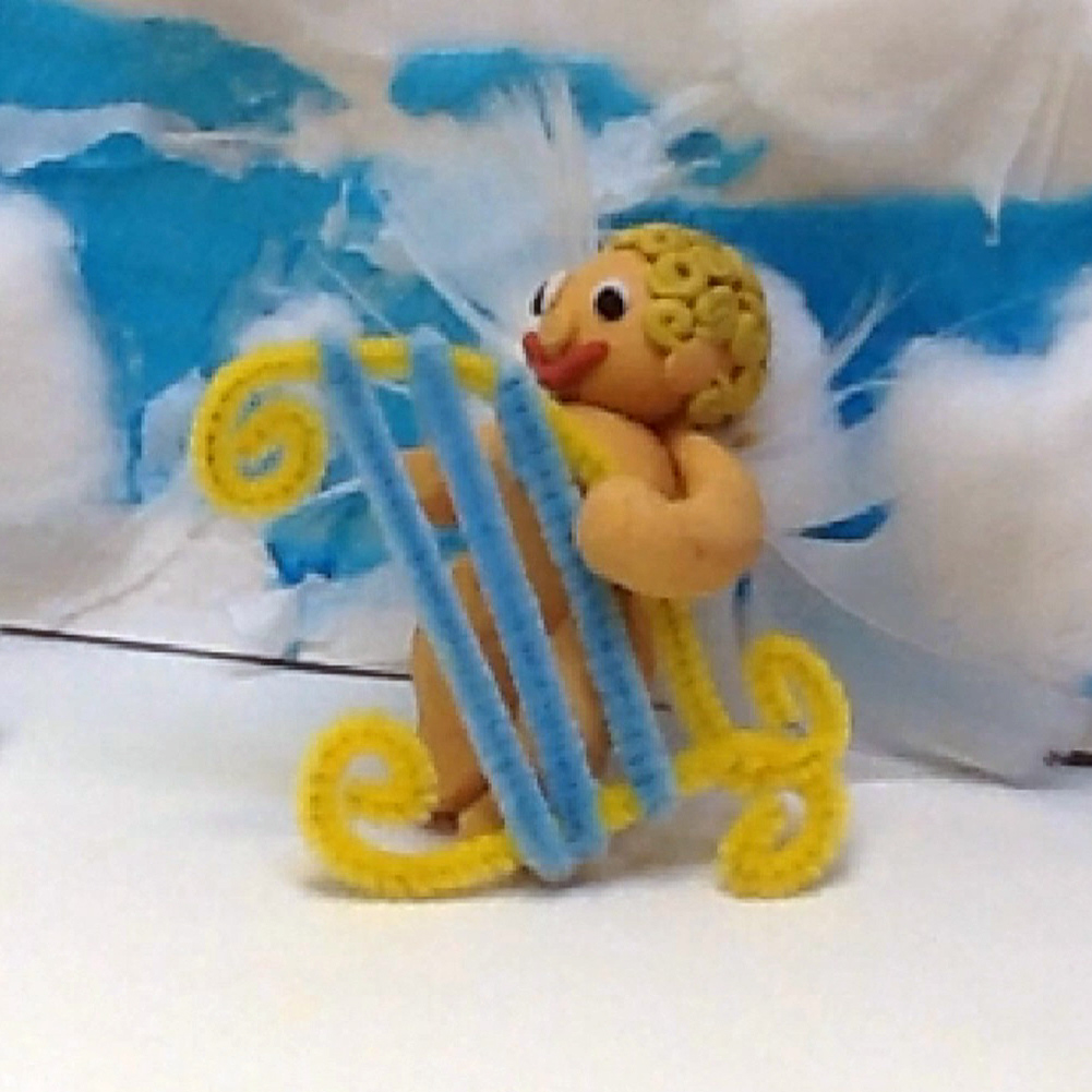 A cherub plays a harp