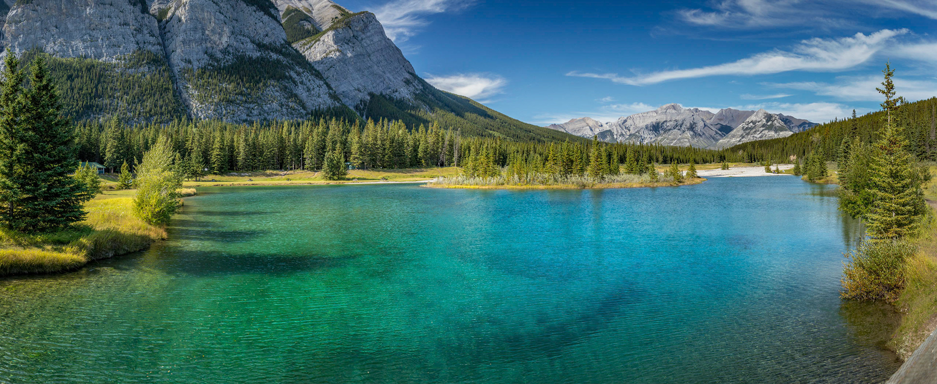 Breathtaking view of Cascade Mountain towering over Cascade Ponds with reflections in the turquoise water, Banff National Park, Alberta, Canada