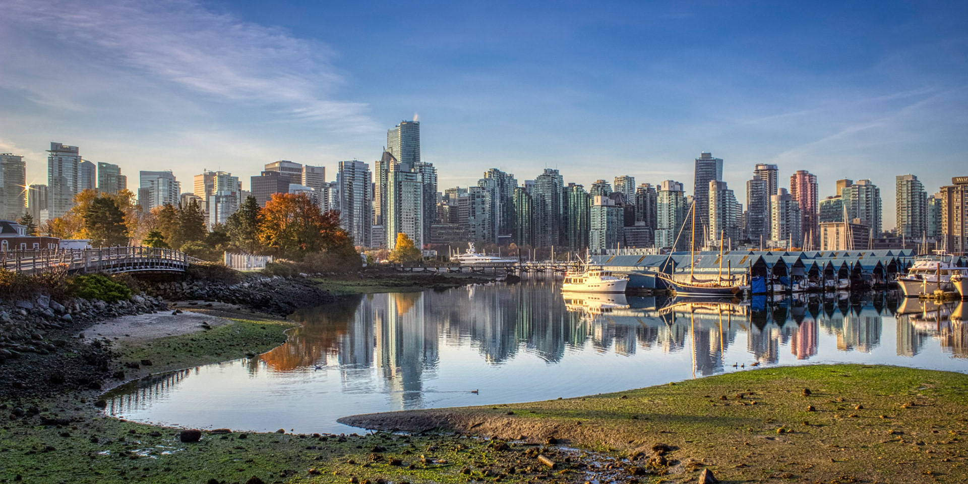 Stunning cityscape view of Vancouver skyline and Burrard Inlet from Stanley Park at sunrise in autumn, Vancouver, British Columbia