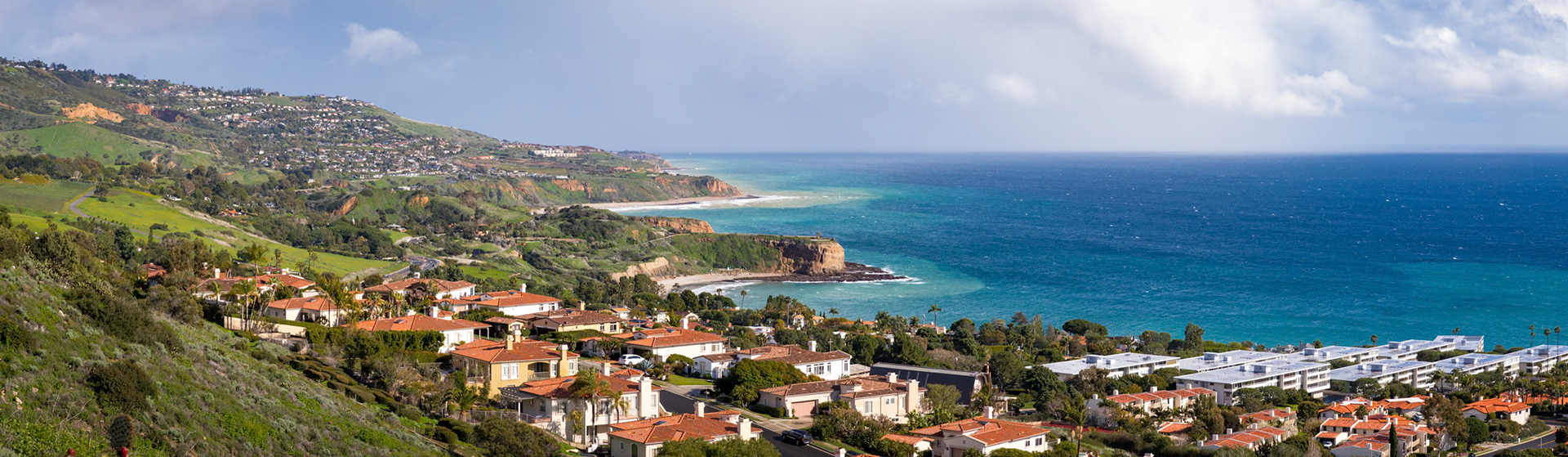 Panorama of Southern California coastline with rolling hills covered with beautiful homes and stunning views of the ocean, Rancho Palos Verdes, California