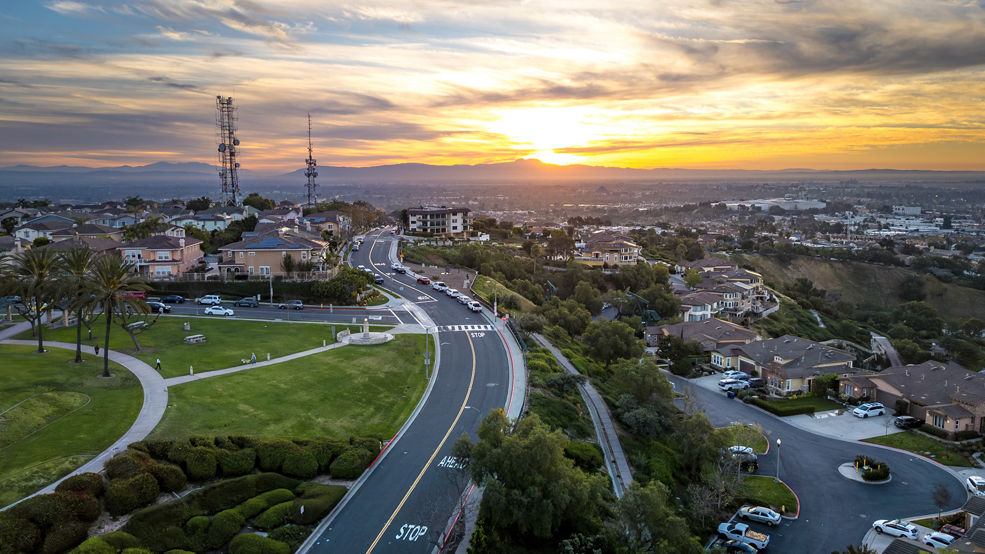 Stunning aerial view of Hilltop Park in Signal Hill, California at sunrise with colorful morning light revealing the landscape