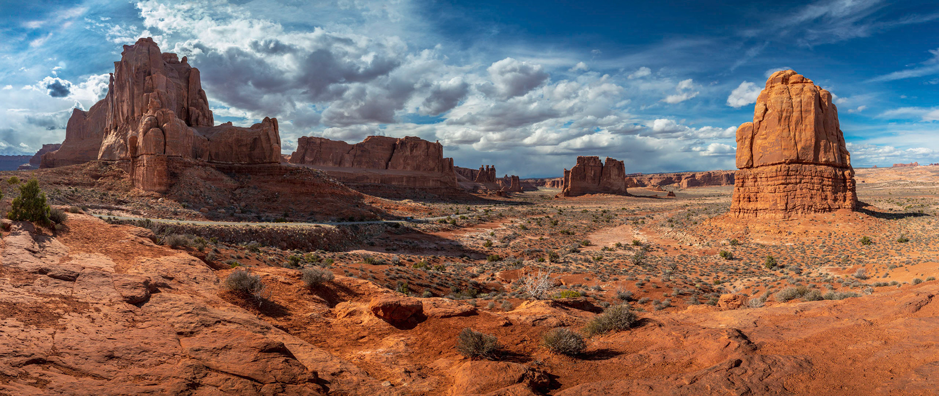 Scenic overlook of towering sandstone giants seen along Arches Scenic Drive near the Park Avenue section of Arches National Park, Moab, Utah