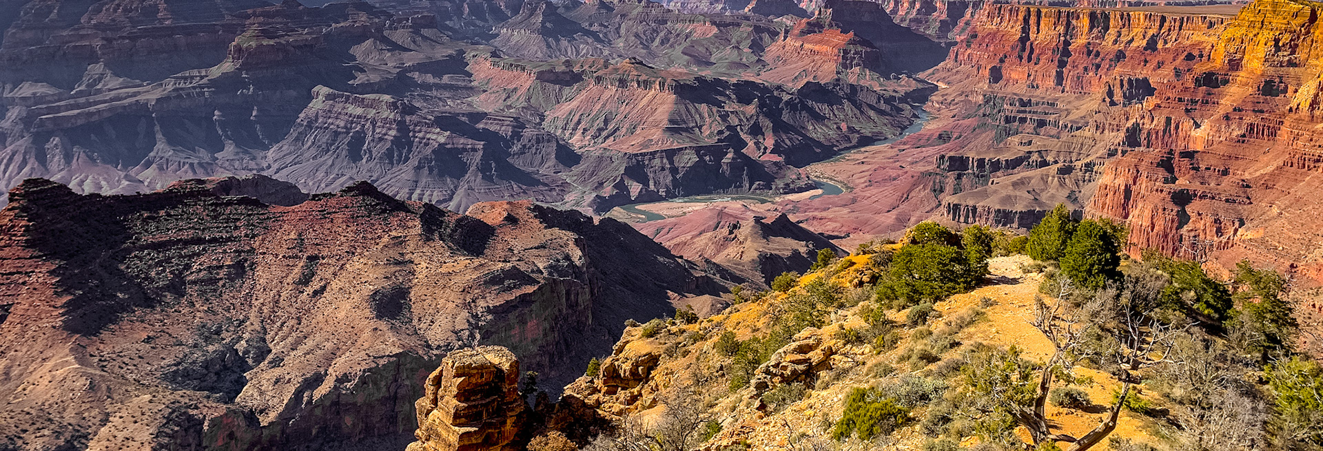 Grand Canyon with its color and grandeur, and the mighty Colorado river in its cradle 