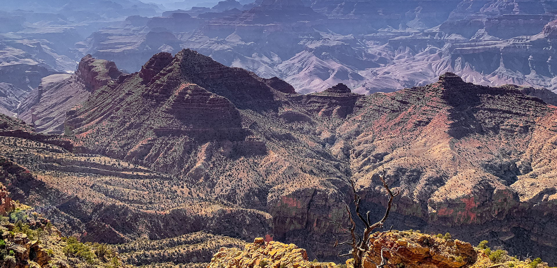 This mountain did not rise; layers of rock were carved by a river to form the mountain range