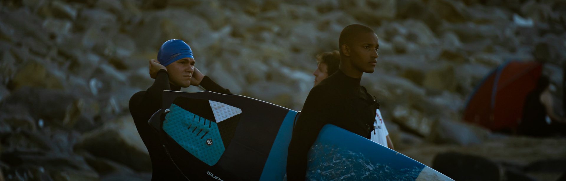 dramatic image of two men in wetsuits