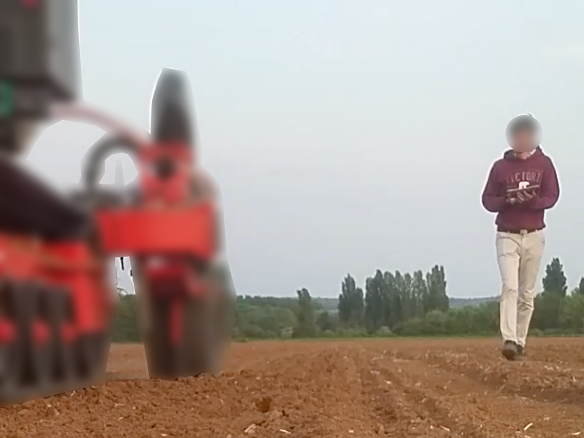 operator holds the tablet with both hands