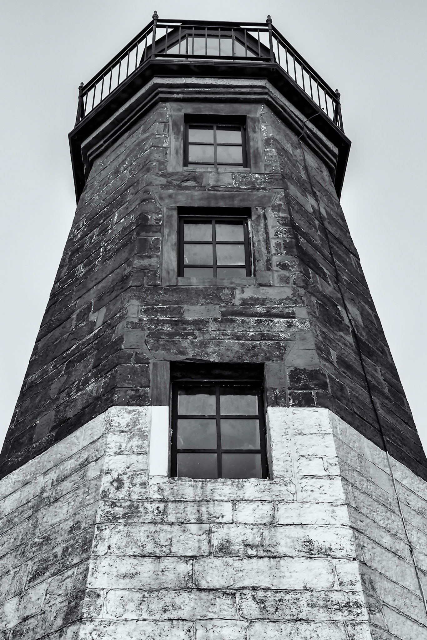 Weatherbeaten stone, Warn mariners near and far, The mighty lighthouse