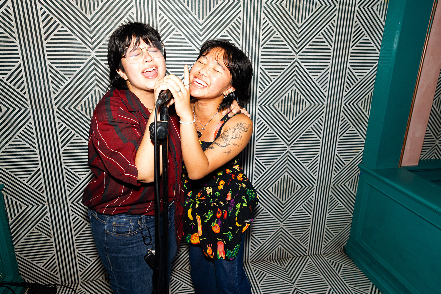 Guests sing along to their favorite pop songs during Brat Karaoke at Honey's LA on August 29th, 2024.