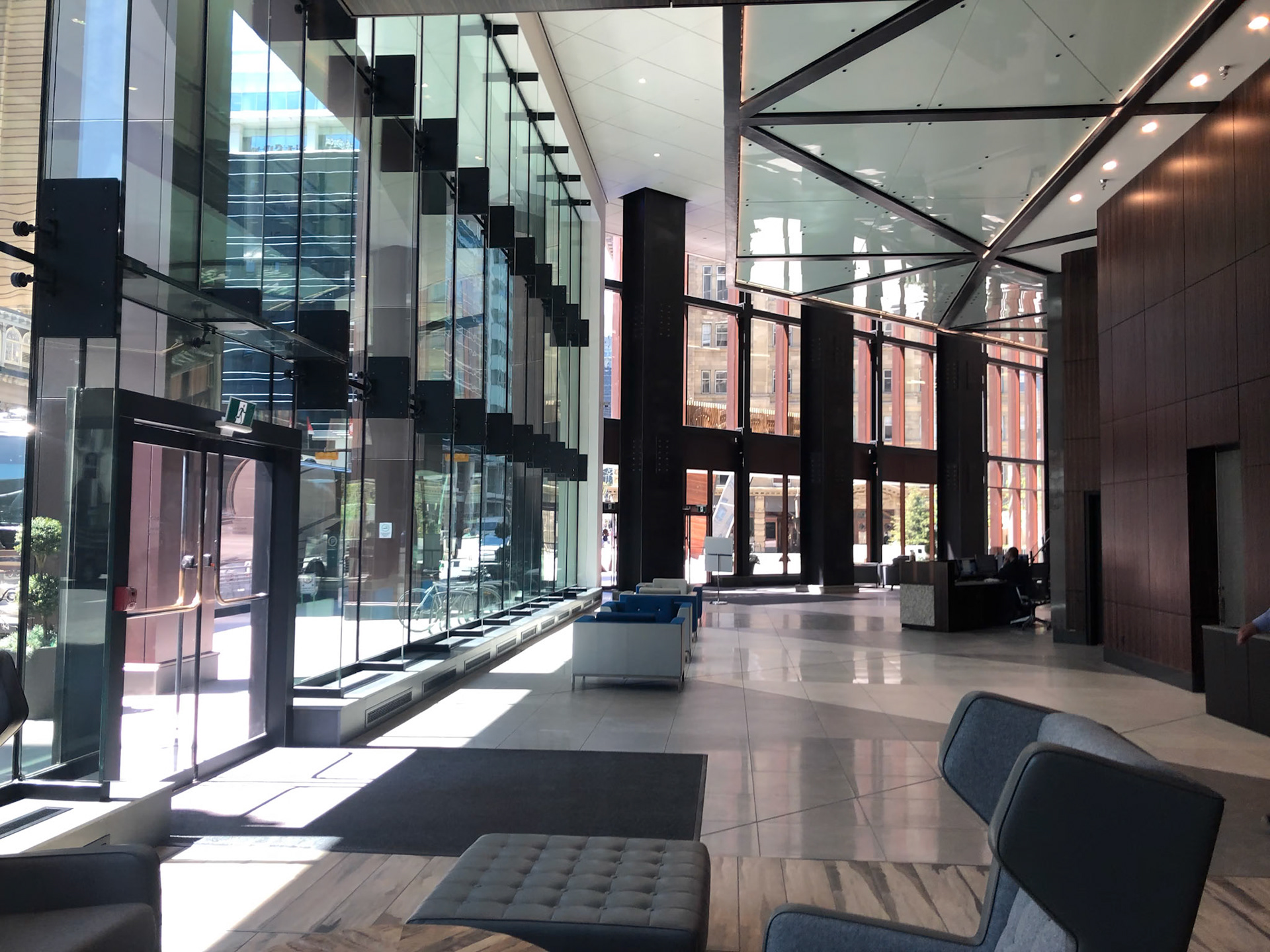 The Edison Lobby Double Height Lobby with Suspended Glass Walkway Above