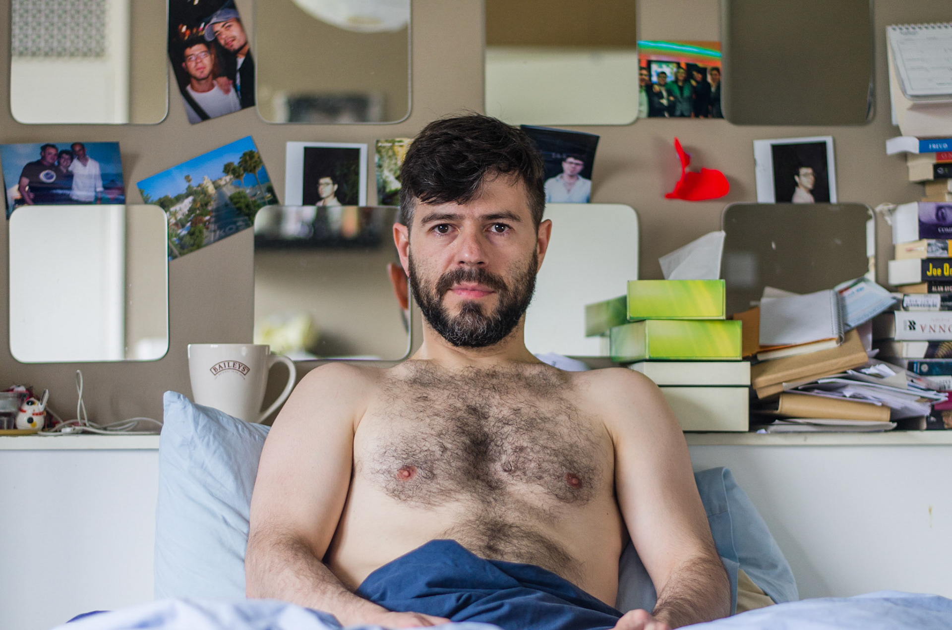 hairy bearded man sits undressed on bed. portrait, male, man, people, morning, breakfast, retrato, manhã, nu, homem, cama, peito, barba, sentado