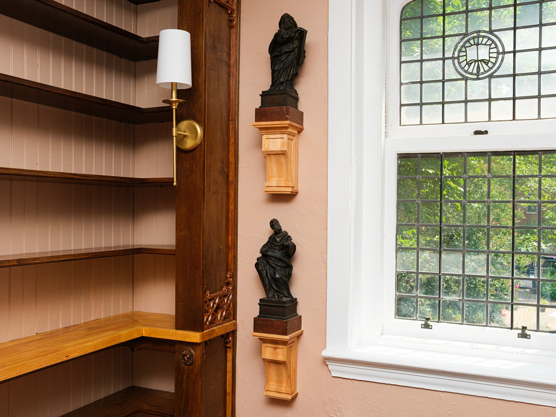 Two Statues Next to Window at the Rectory Library