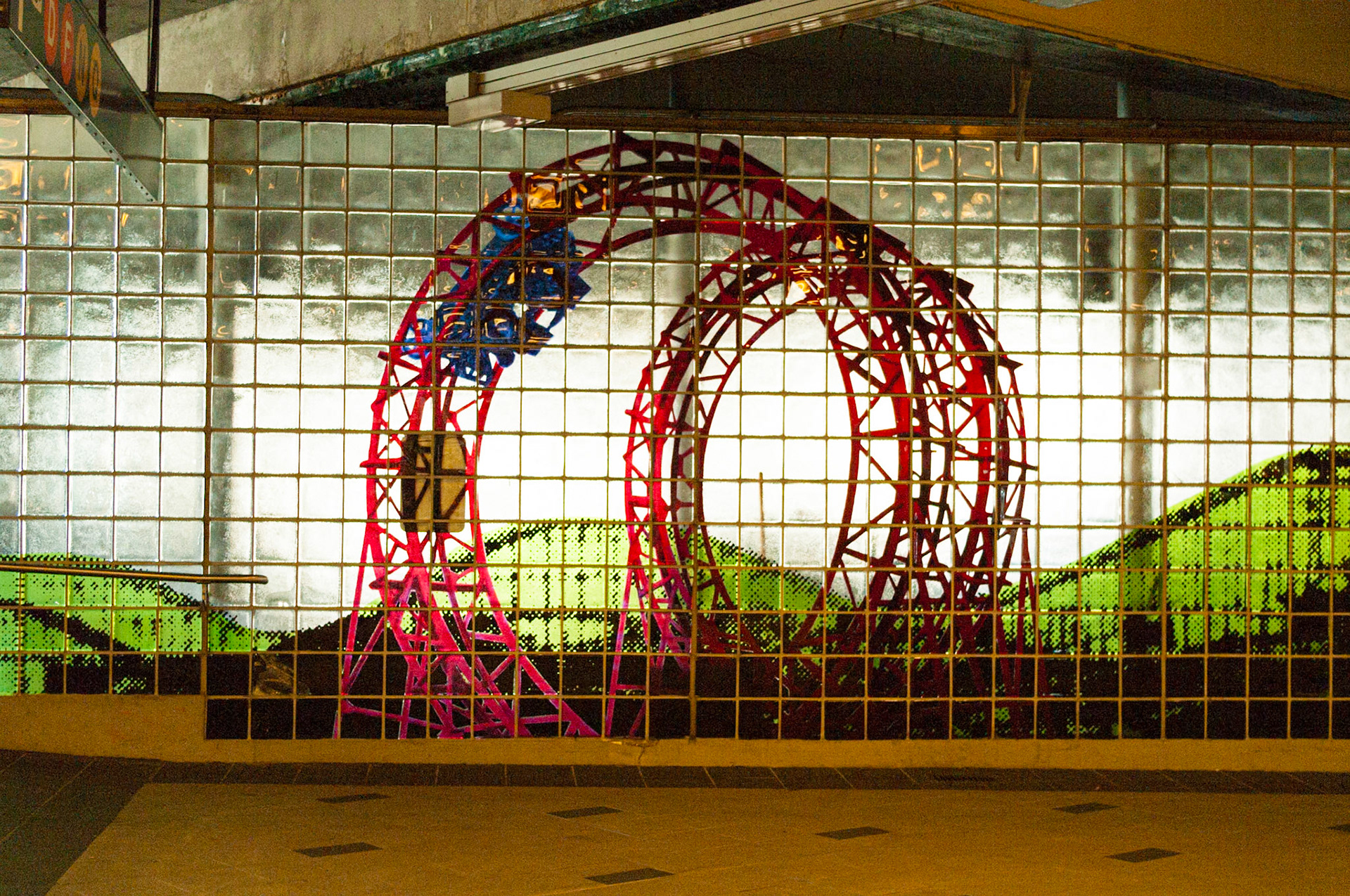 Glass Blocks at Coney Island Statin Depicting Loop Coasters
