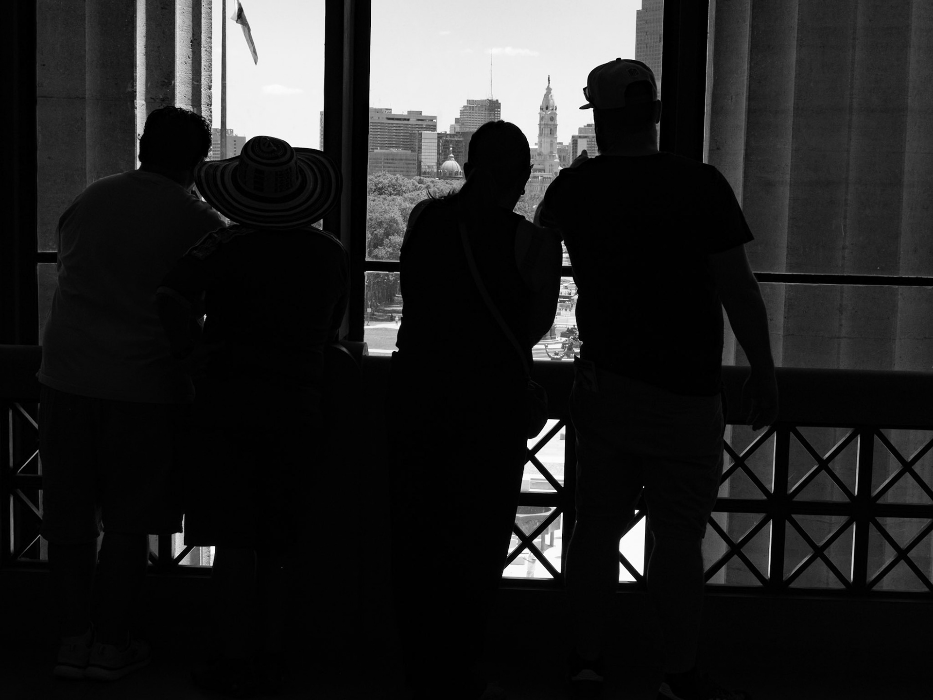 Sihouetted Museum Visitors Looking at the City June 2026