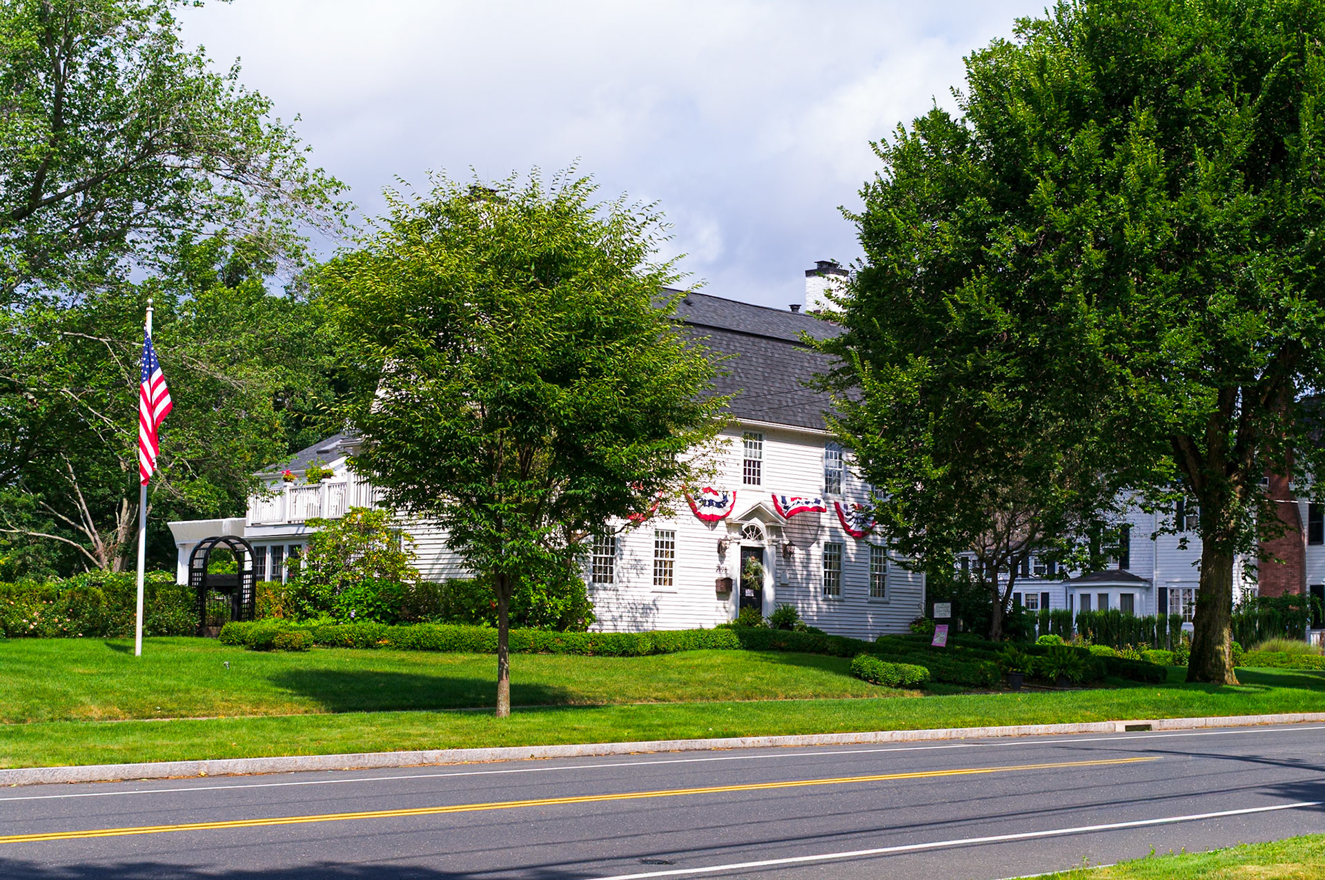 Gambrel Roof Patriotic House on Main Street Glastonbury