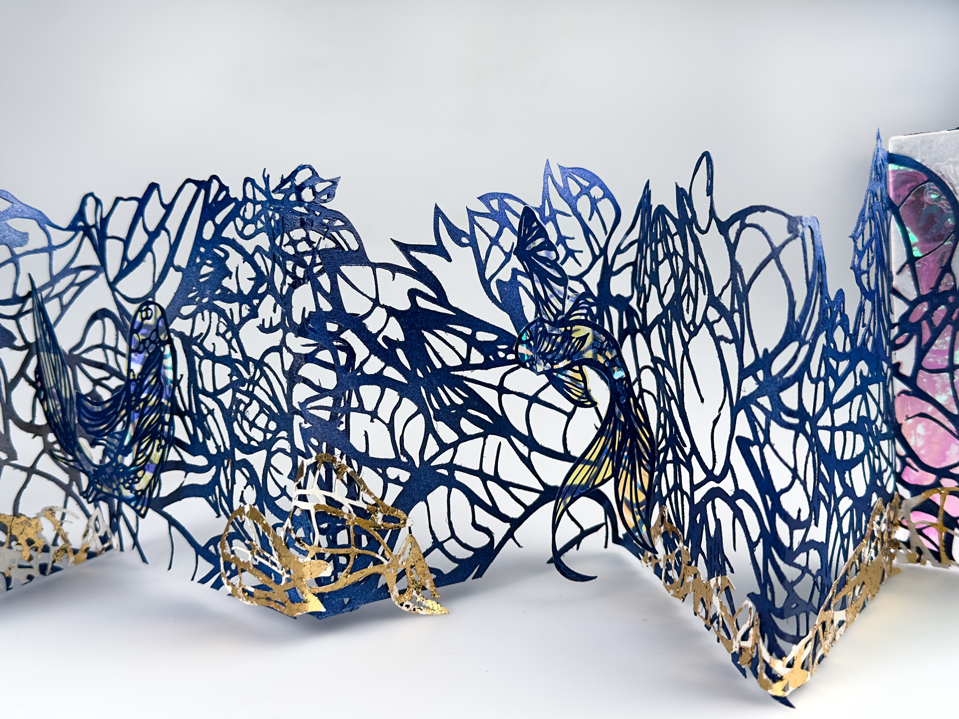Hidden Upstream, hand cut paper, acrylic, cellophane, 31 x 6 x 5.5 inches,2025