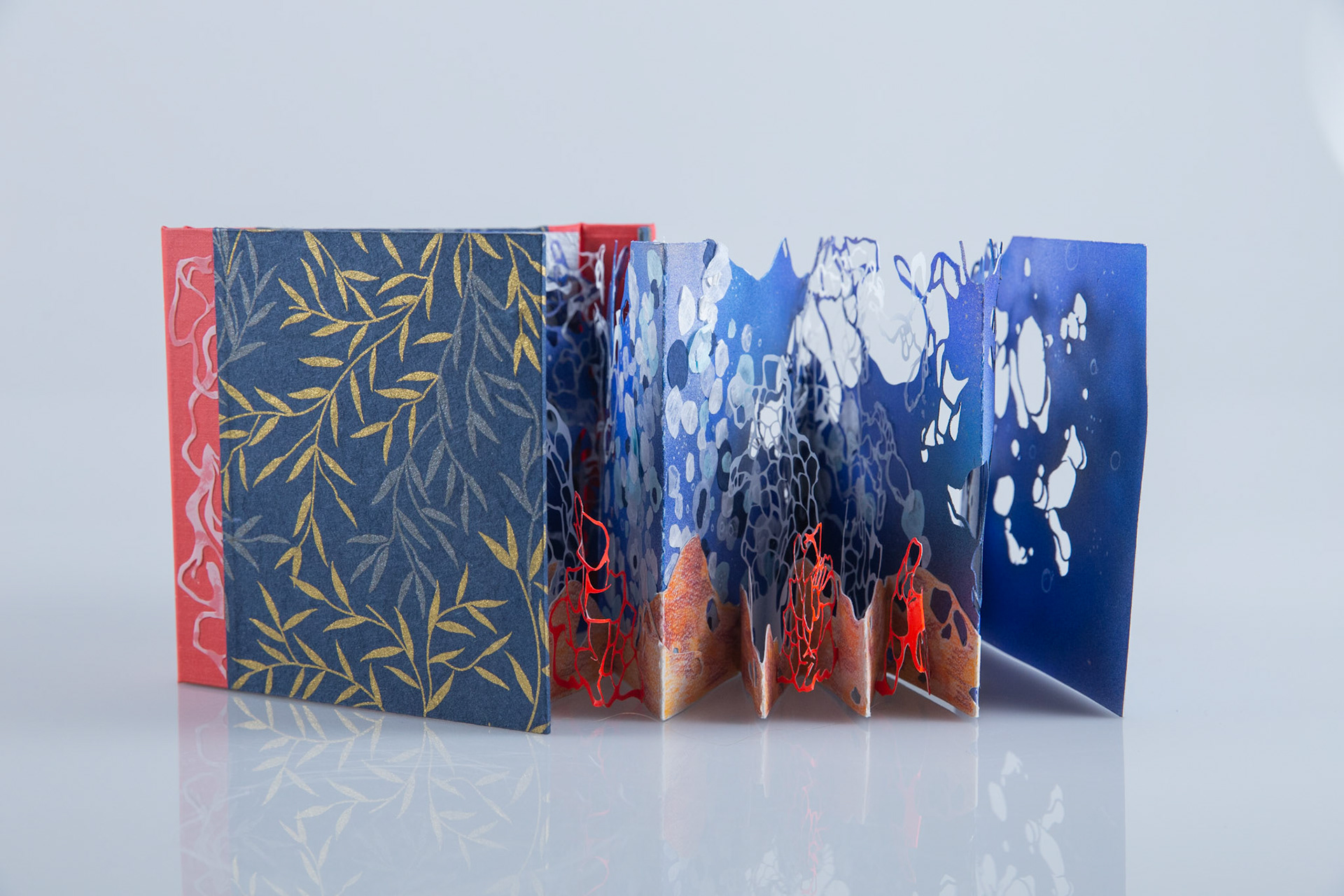 Wonders Down Unda Back View Opened, paper, embroidery floss, binders board, 4” x 4 7/8” x 1 9/32” (closed), 2022