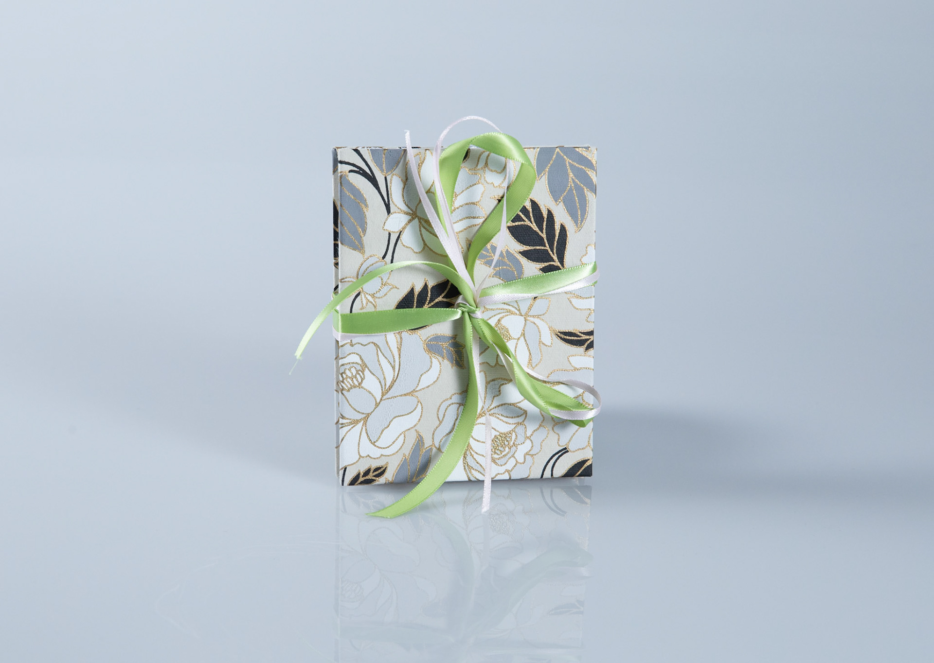 Slotted Accordion, paper, binders board, ribbon, 5 x4 inches