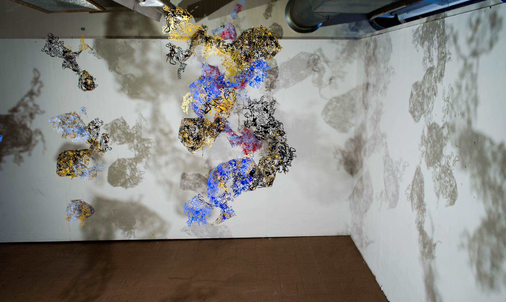 Shape Shifting , paper, acrylic, monofilament, dimensions variable
