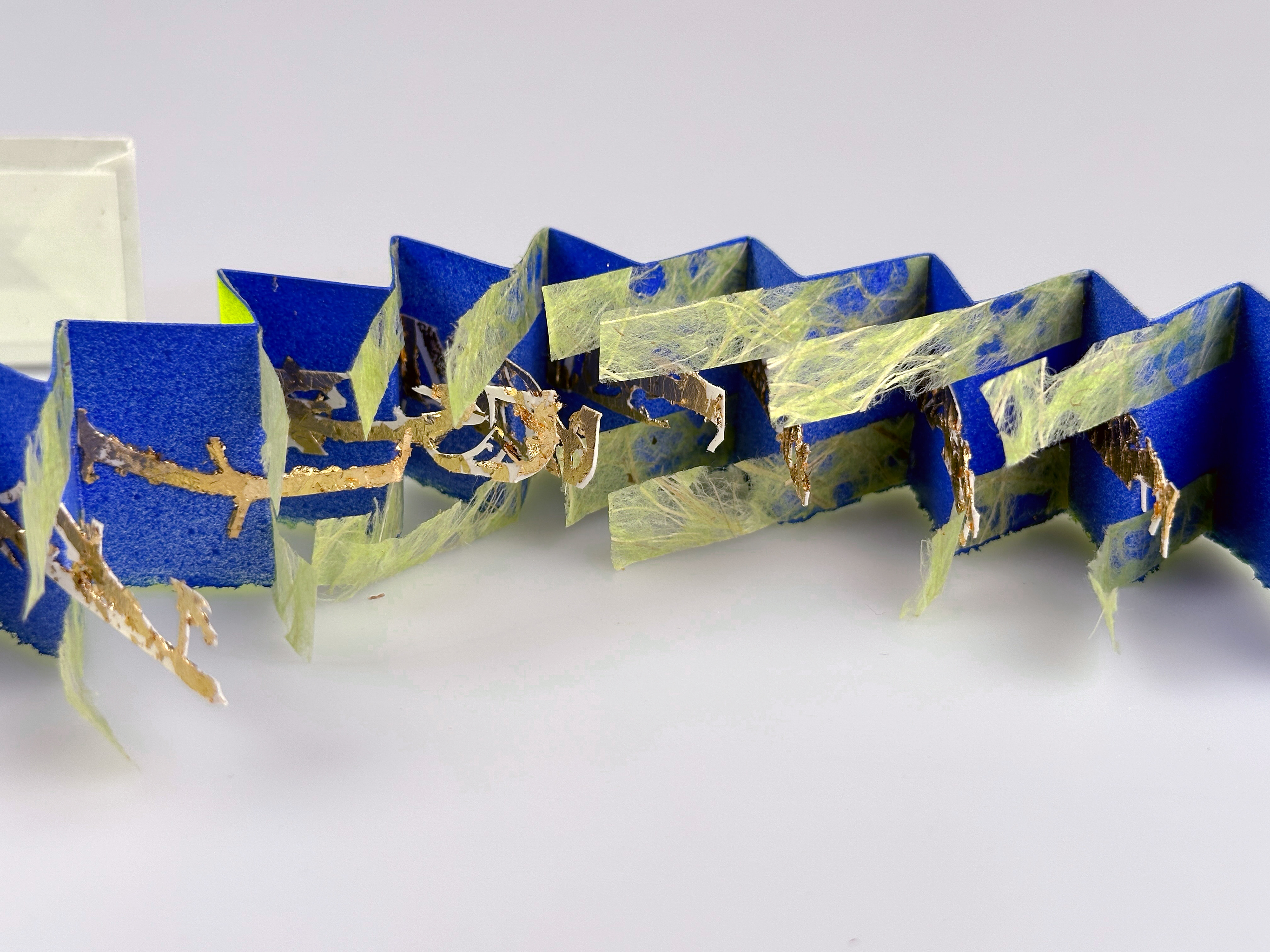 Tide’s Embrace, hand-cut paper, binders board, book cloth, lace paper, cellophane 14.5 inches x 2.75 inches x 1.5 inches (opened), 2024