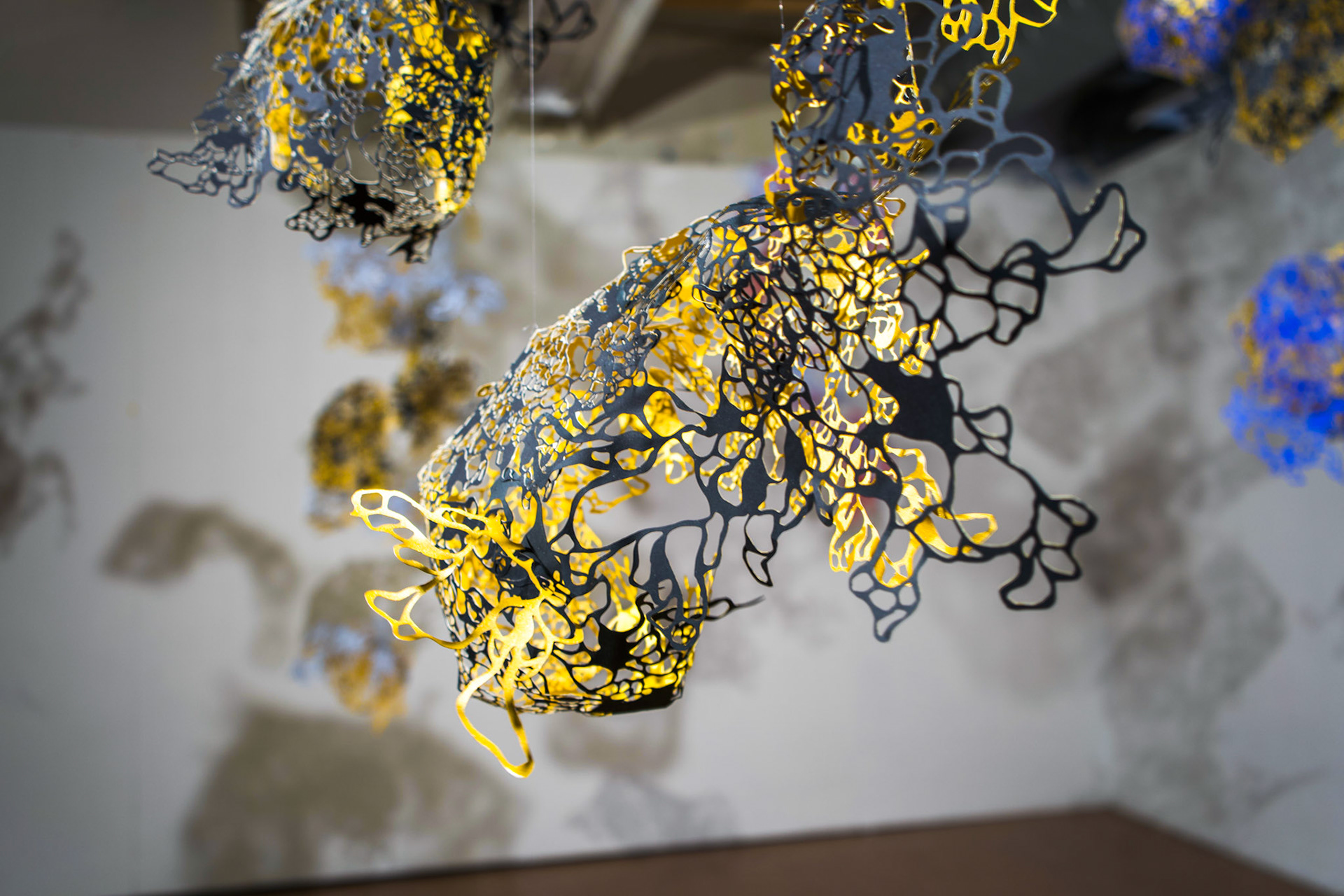 Shape Shifting Detail Shot, paper, acrylic, monofilament, dimensions variable