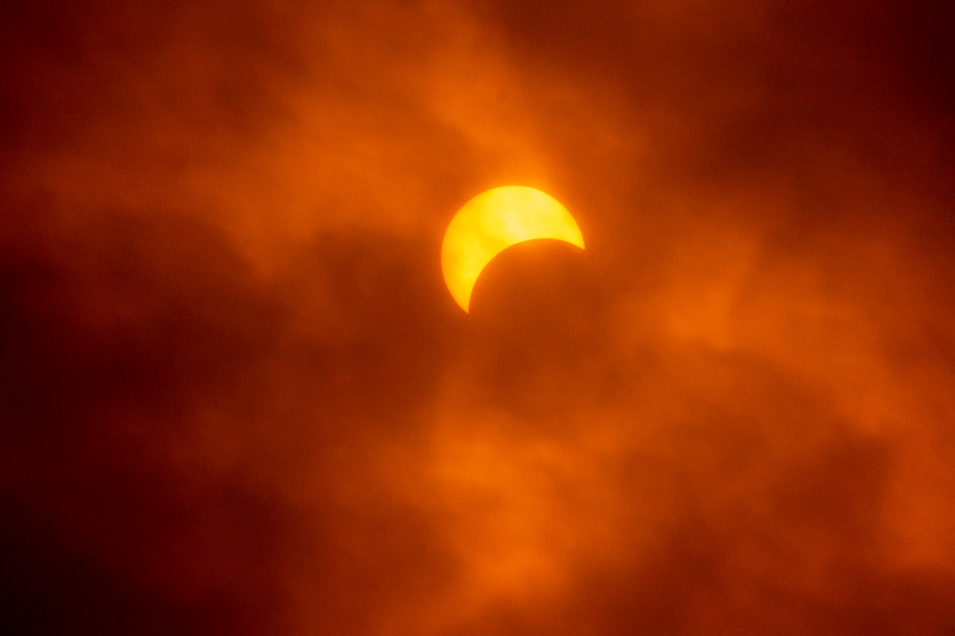 Partial Eclipse visible through clouds during the 2024 Total Solar Eclipse
