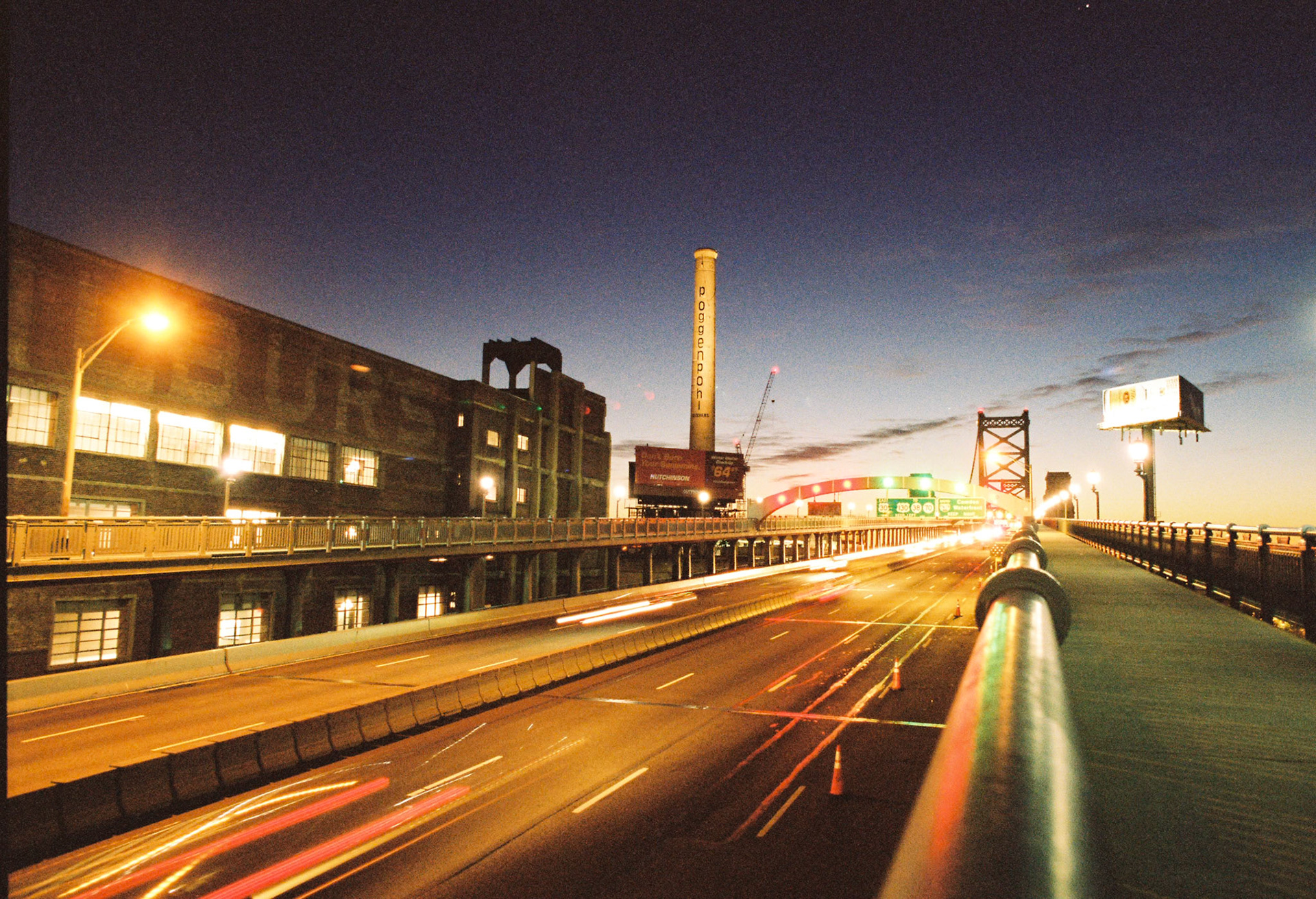 Ben Franklin Bridge - Philly Side - Image Capture: 35mm Kodak Portra400 Film - Nikon F100 24mm f/2.8 AIS lens -  Handheld Exposure .4sec f/5.6 - Developed and digitized by Indie Photo Lab.