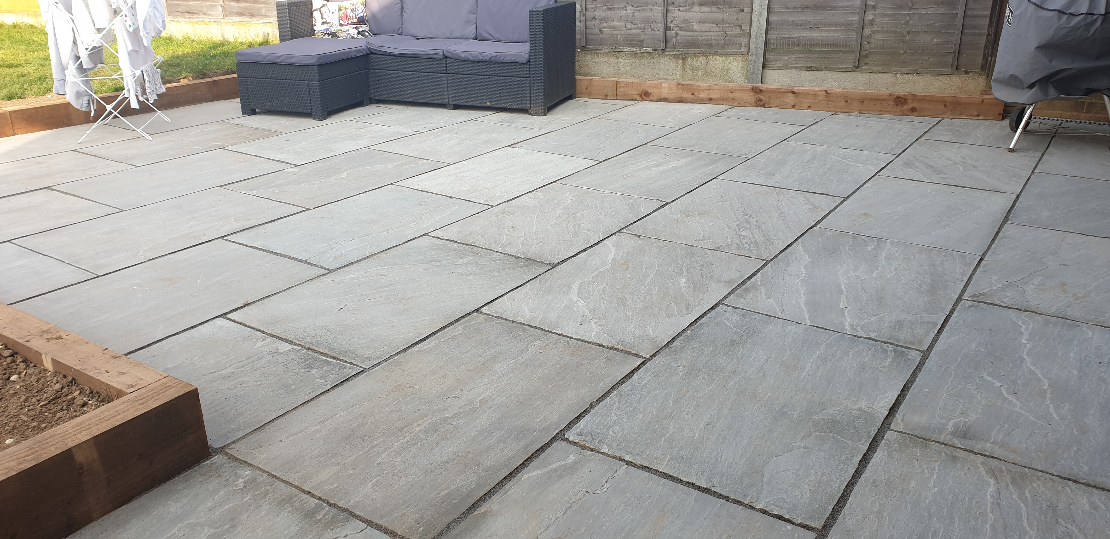 Grey Sandstone Patio with Sleeper edging