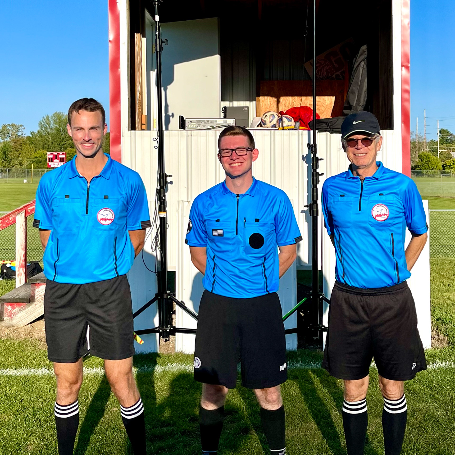 Post-game soccer officiating crew
