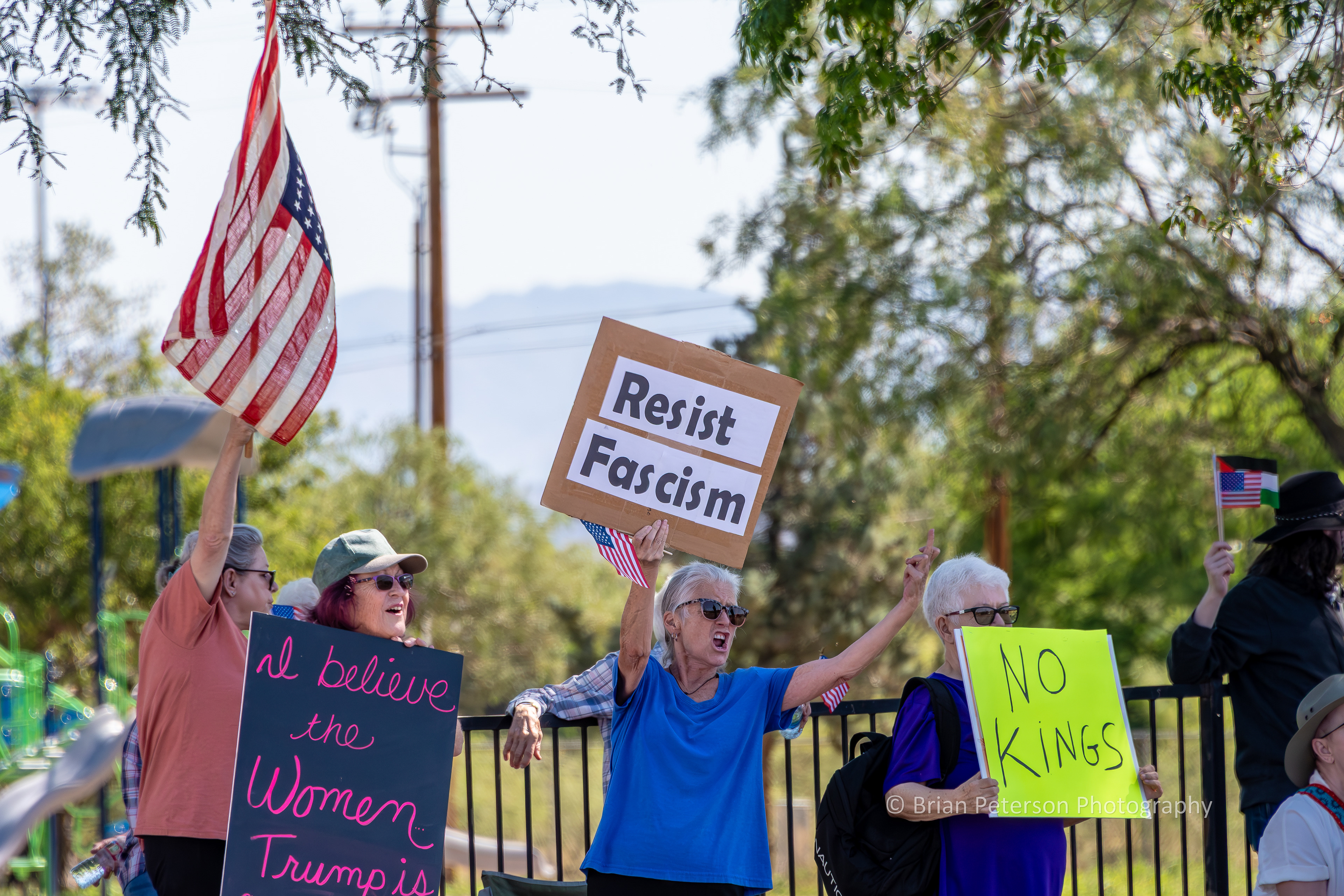 I'm not certain at whom the lady is flipping the bird. At least it's not directed at the photographer.