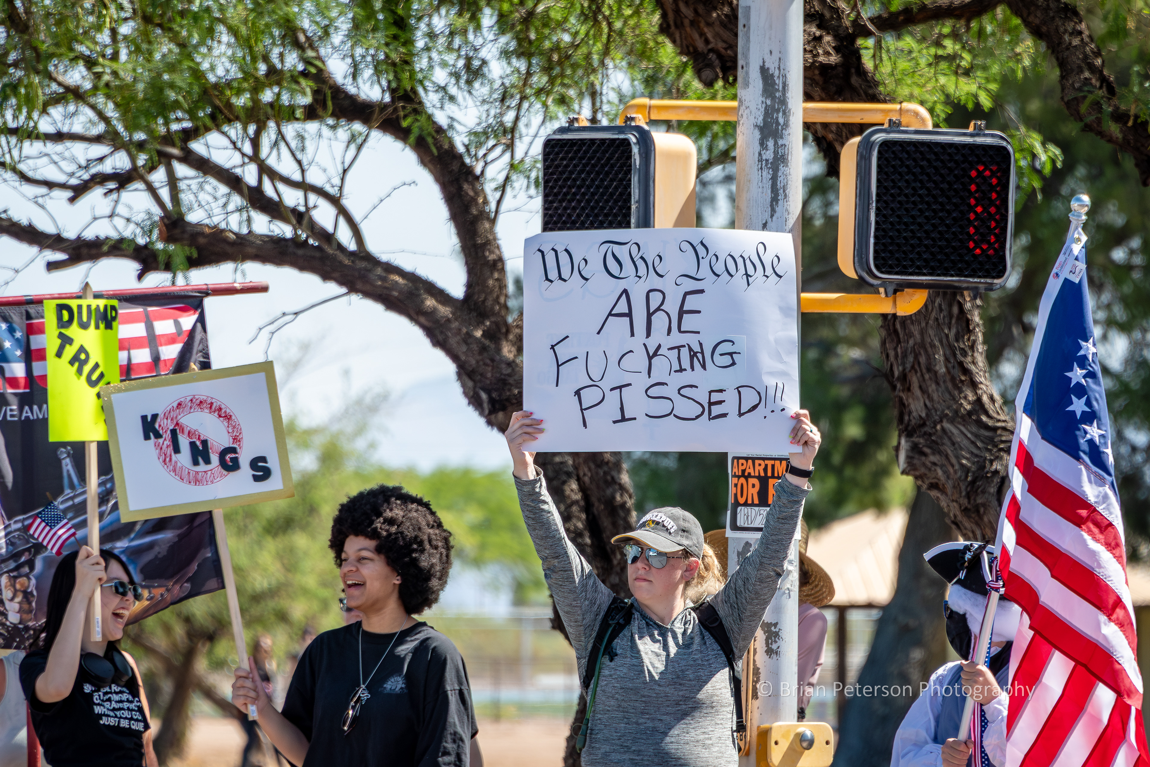 The sign says it all, but I like the vibe of the two young ladies on the left.