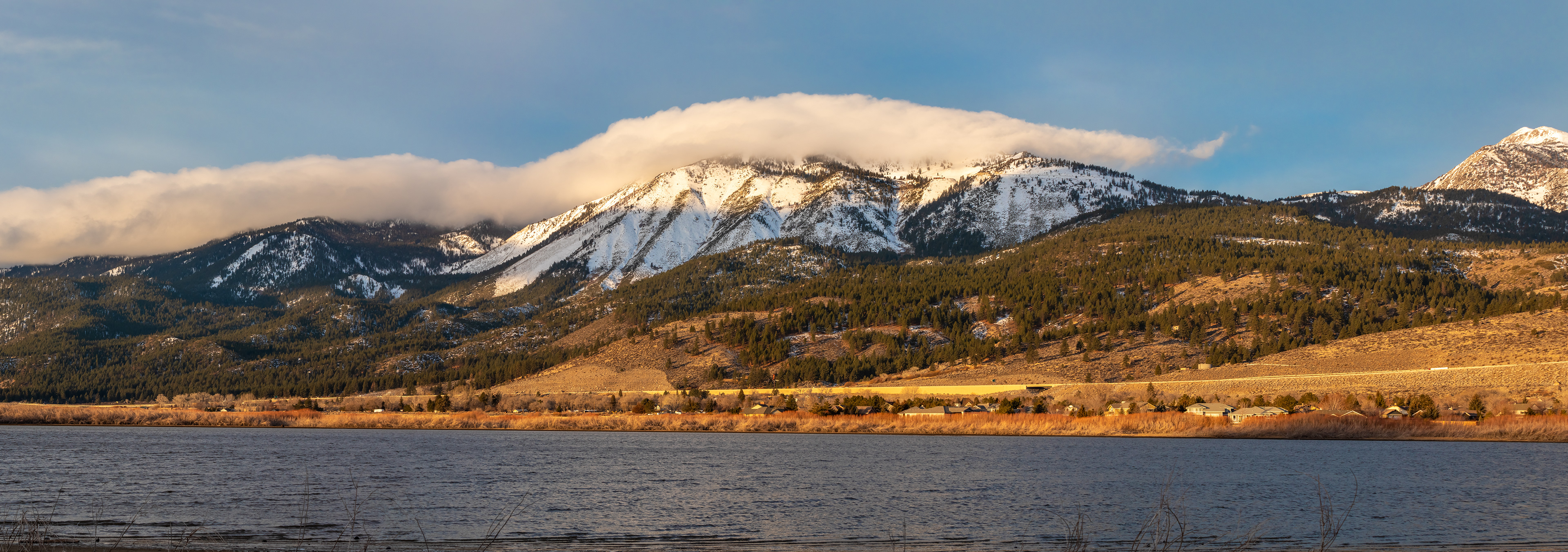 Slide Mountain with cloud cover, and Washoe Lake in the foreground.