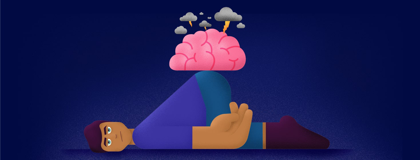 a man laying on the ground with a storm over a brain on his back