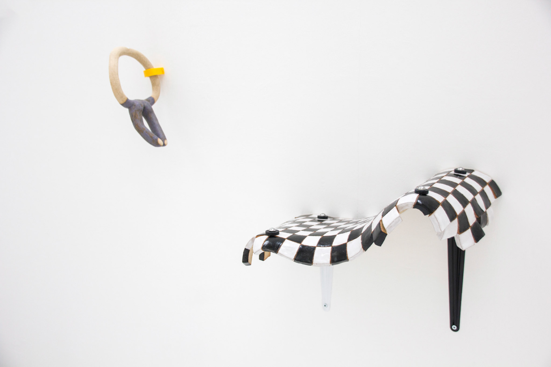 'Riding the Wave',  glazed stoneware, pipe holder clip, brackets, rubber washers,  60 x 83 x 29cm