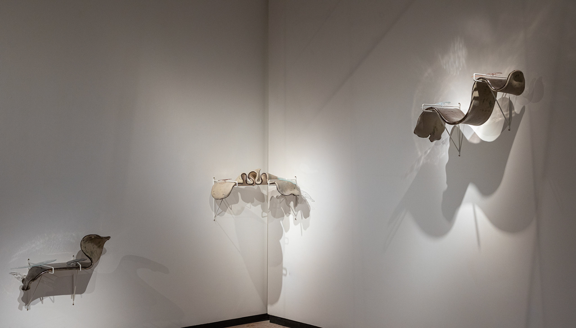 'Silver Fish (small, corner, up)' , metal brackets, glazed stoneware, suckers, textured glass