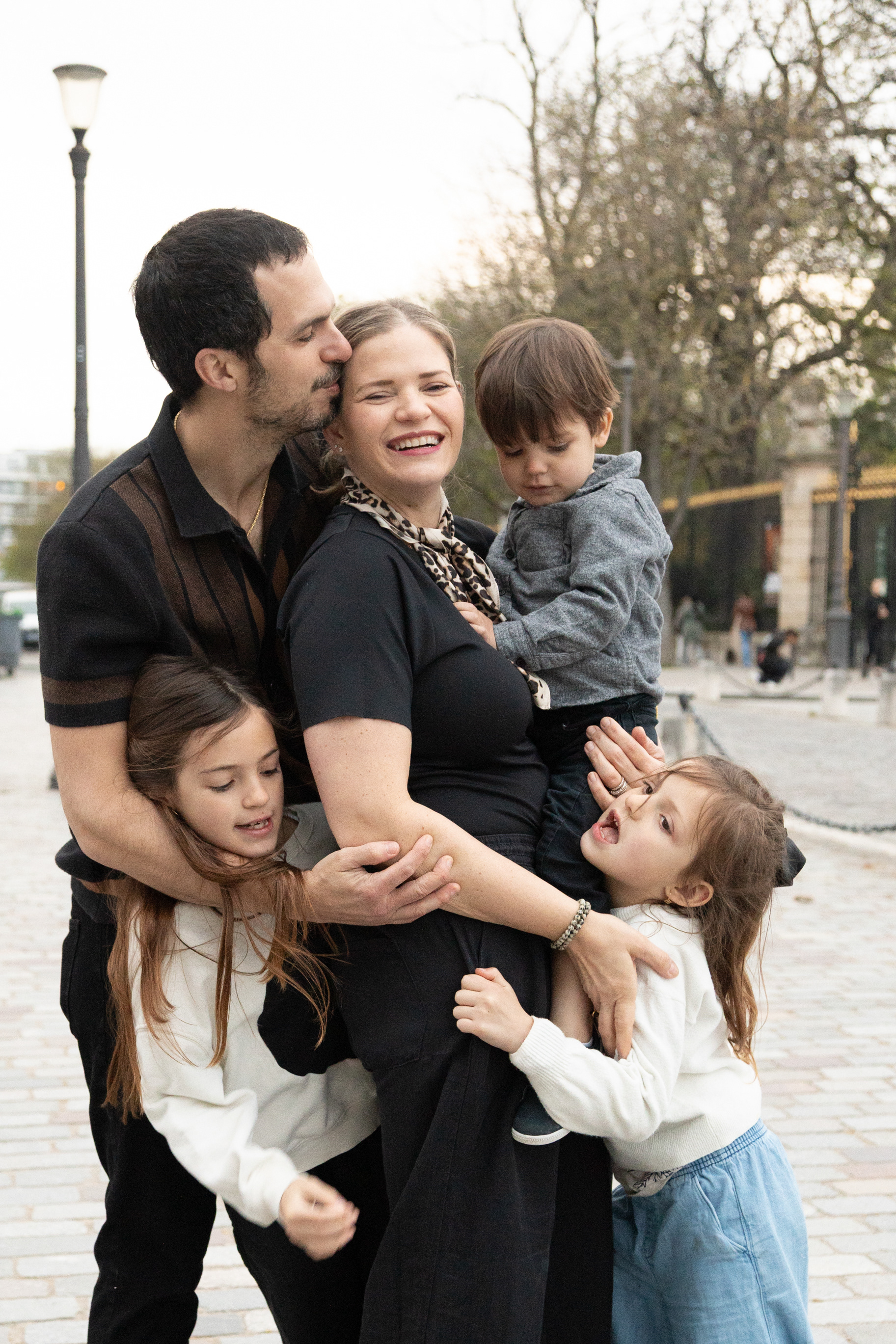 Group portrait of a large family of five during their Paris vacation